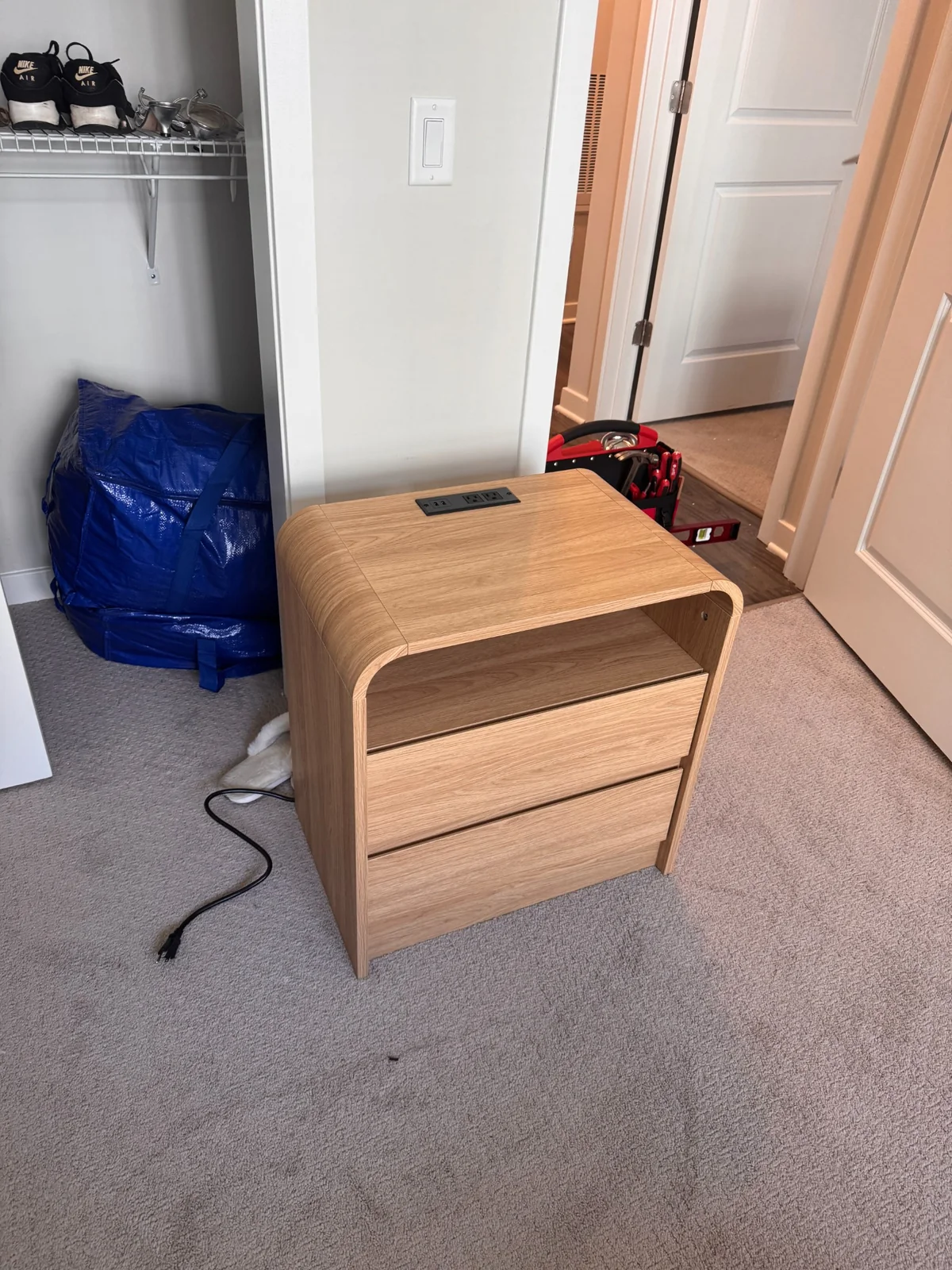 Light wood nightstand with drawers and built in power assembled by Assemble Pro NJ