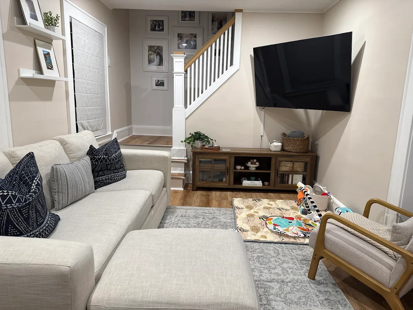 TV mounted on an angled living room wall by Assemble Pro NJ